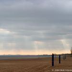 The Cedar Point Beach and Wicked Twister sit against a backdrop of crepuscular rays