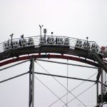 An empty Magnum XL-200 train crests the lift hill during early morning testing.