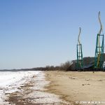 The blue sky may seem like summer, but the thick ice along the shore reminds everyone that it isn't.