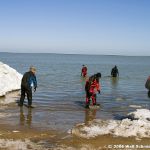 Sandusky firefighters clear the ice