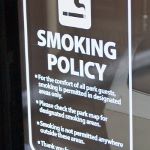 Notice on ticket office window of new smoking policy