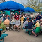 Teams and guests enjoy food as door prizes are awarded.